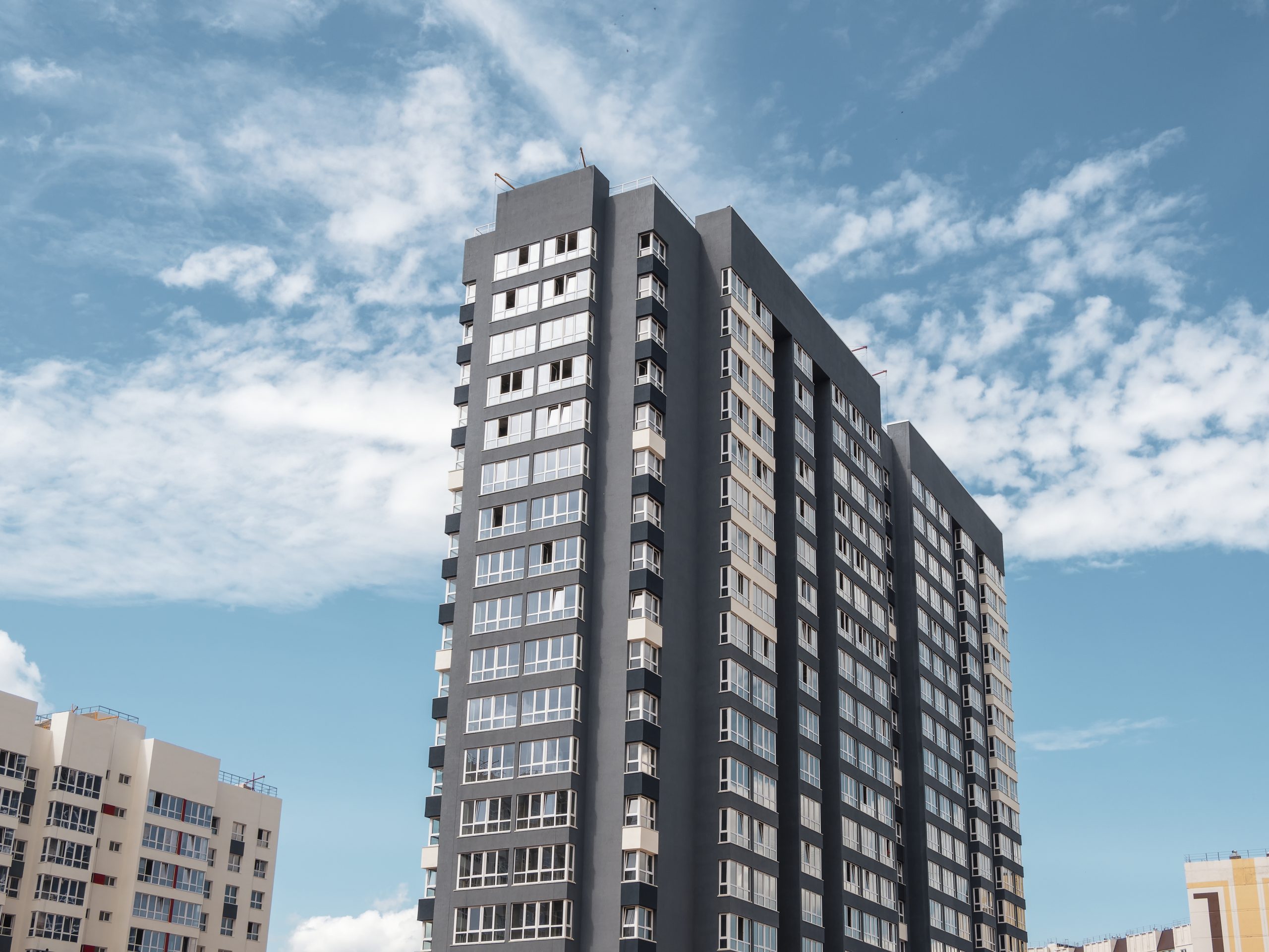 modern panel construction new residential area beautiful colorful new buildings colored wall against blue cloudy sky copy space scaled